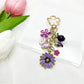 Keypus daisy charm keychain displayed on a white background showing full length