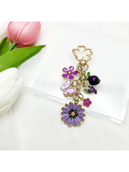 Keypus daisy charm keychain displayed on a white background showing full length