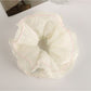 Gifty double layer scrunchie packaged in clear plastic with branding label