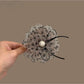 Beau delicate polka dot mesh hair clip with black and white pattern