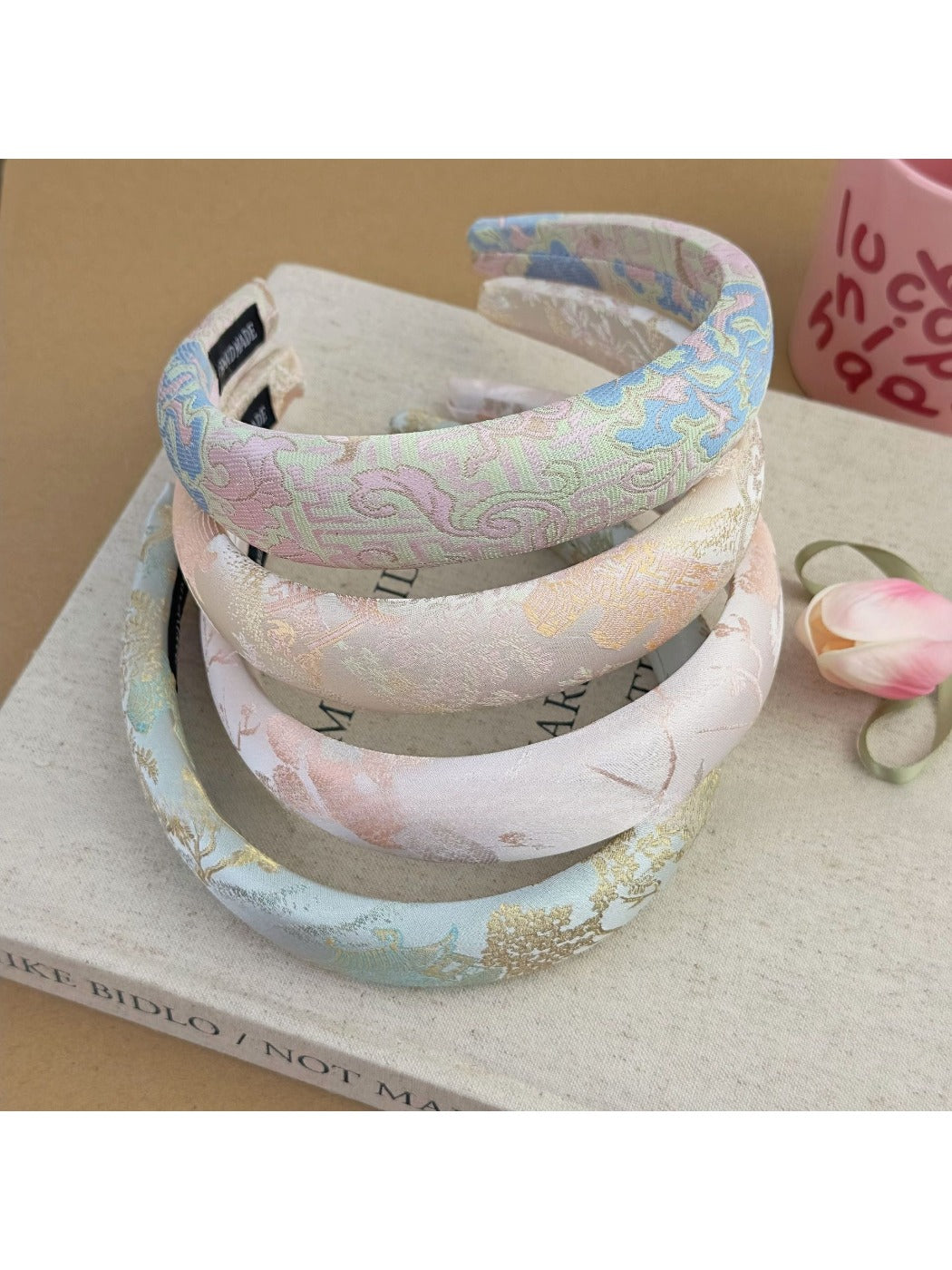 Gifty flower headband displayed on a white background highlighting floral embroidery