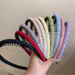 Side view of Gifty minimalist headband highlighting its slim design