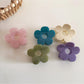 Close-up of Beau flower hair clip showing textured petals and center detail