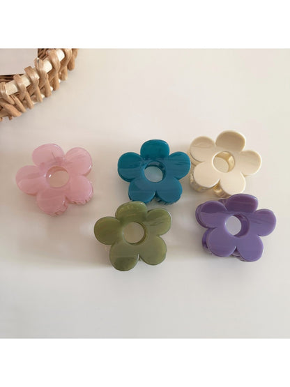Close-up of Beau flower hair clip showing textured petals and center detail