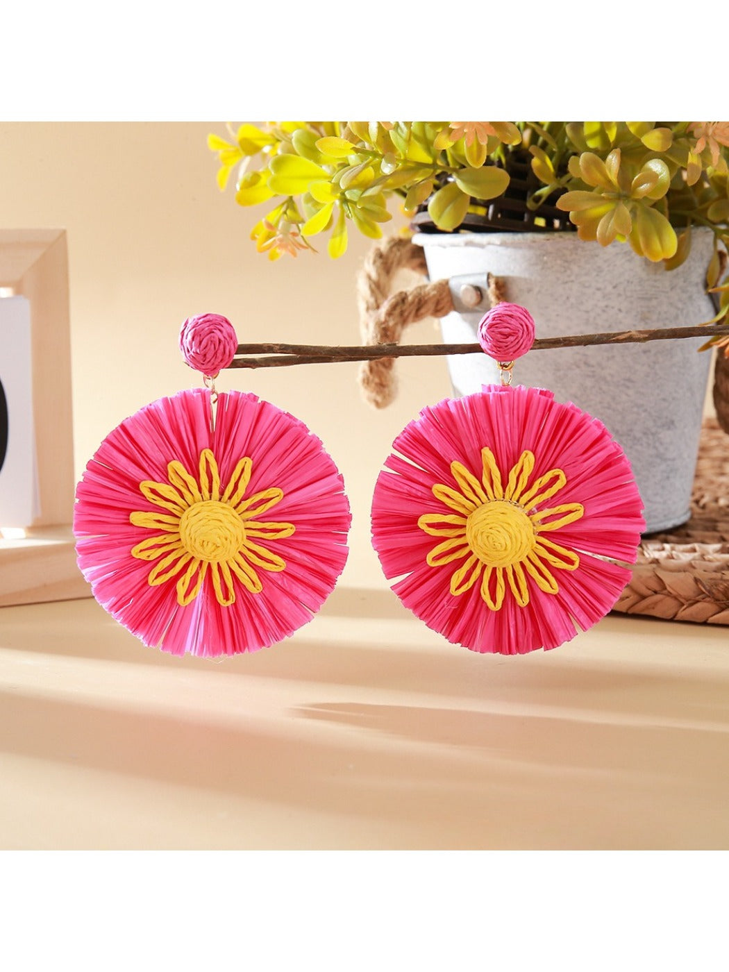 Earedge sunflower earrings shown with matching accessories on a neutral background