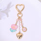 Red leather heart flower bag charm keychain displayed on white background
