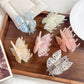 Beau sweet butterfly shaped hair claw clip in soft pastel pink on white background