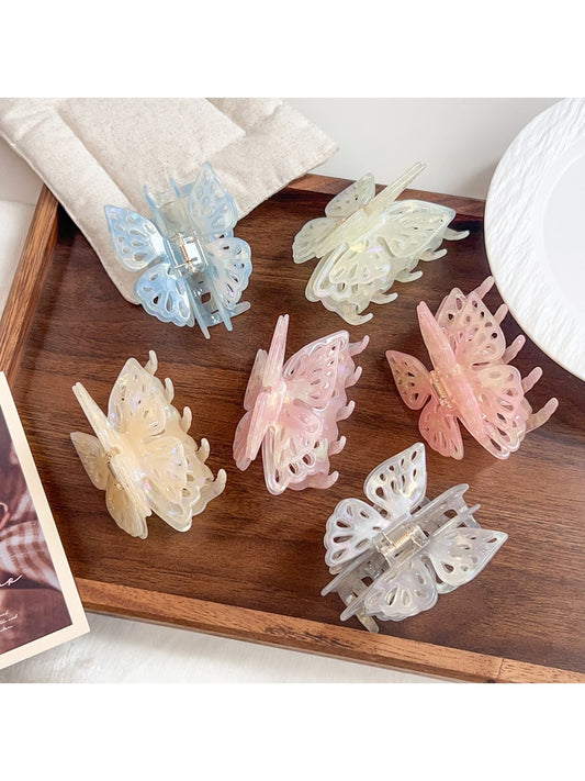 Beau sweet butterfly shaped hair claw clip in soft pastel pink on white background