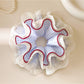 Close-up of Gifty plaid scrunchie showing lace detail and fabric texture