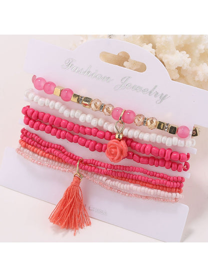 Lovra flower shaped pendant beaded bracelet in natural light emphasizing color and design
