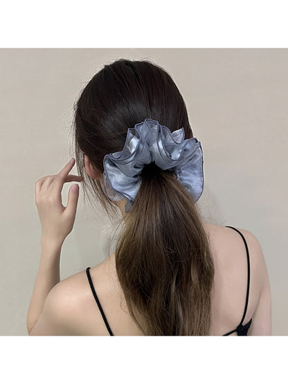 Gifty satin scrunchie showing ruched texture and layered design