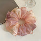Side view of Gifty sweet printed scrunchie highlighting its double layered construction