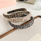 Close-up of Gifty tiny floral print fabric headband showing detailed pattern