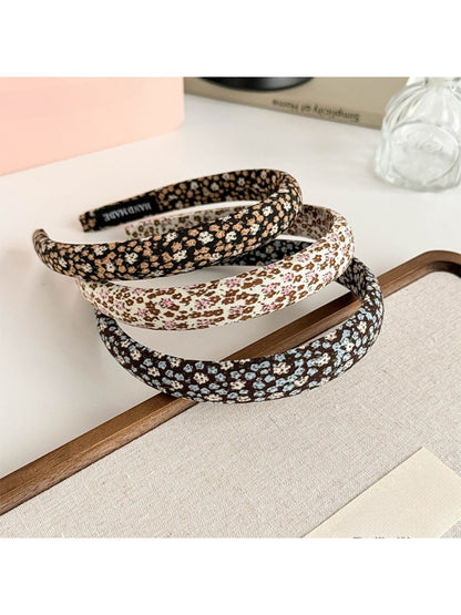 Close-up of Gifty tiny floral print fabric headband showing detailed pattern