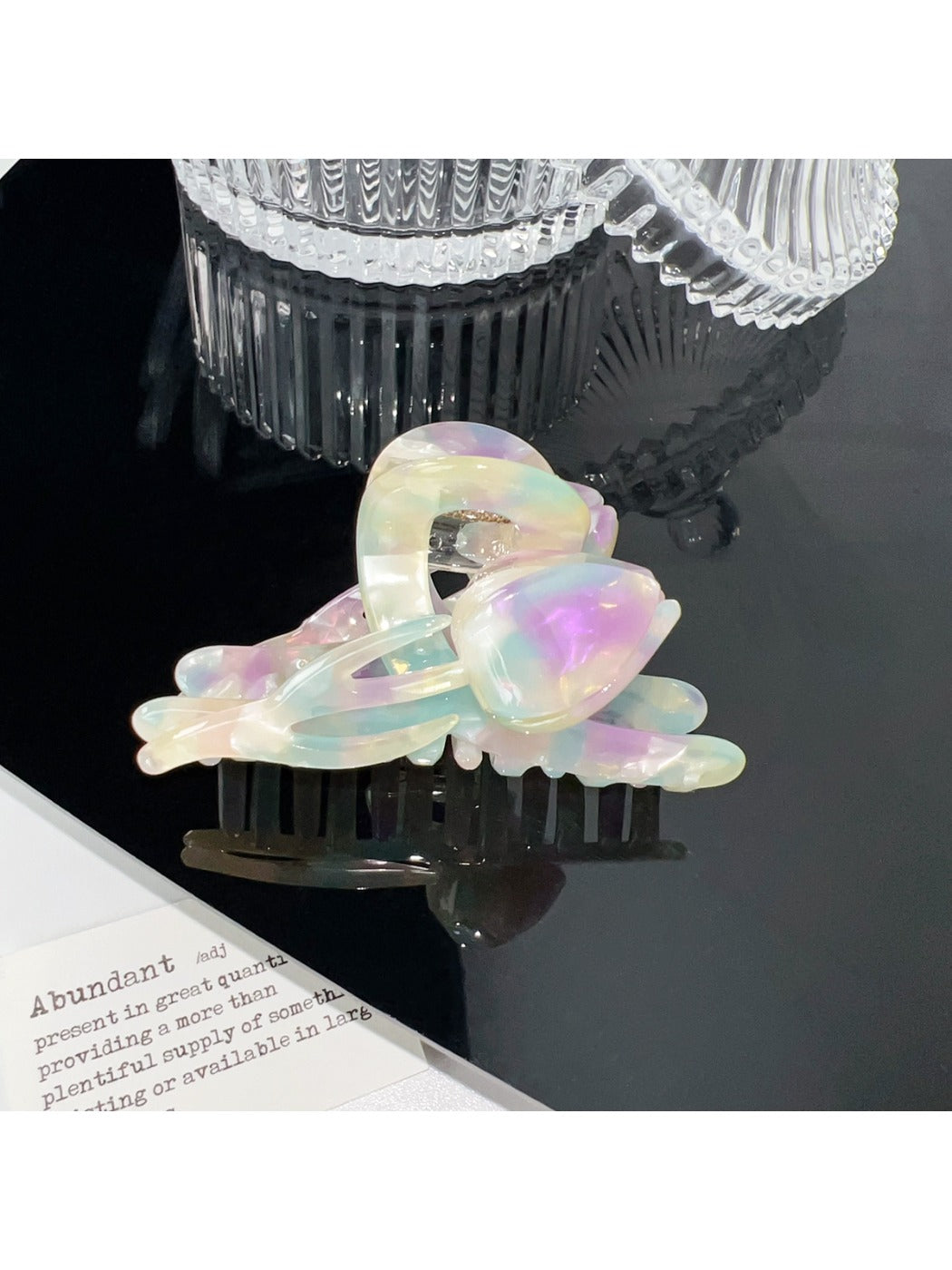 Beau floral hair claw clip photographed with soft shadows on white background