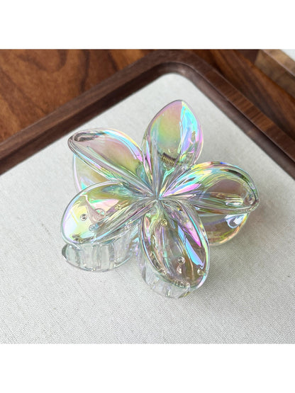 Beau flower shaped claw clip in pink with metal spring visible