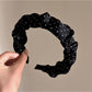 Gifty headband displayed flat showing full pleated design and polka dot print