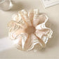 Side view of Gifty Sweet Bow Print Ruffled Scrunchie highlighting fabric and bow design