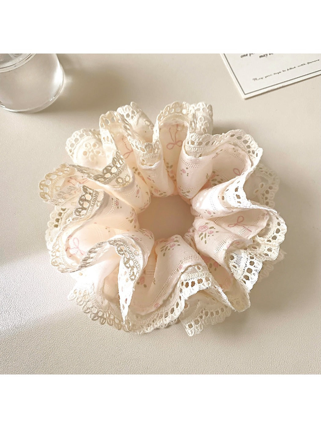 Side view of Gifty Sweet Bow Print Ruffled Scrunchie highlighting fabric and bow design