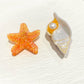 Side view of Beau conch shaped claw clip highlighting curved design and clasp