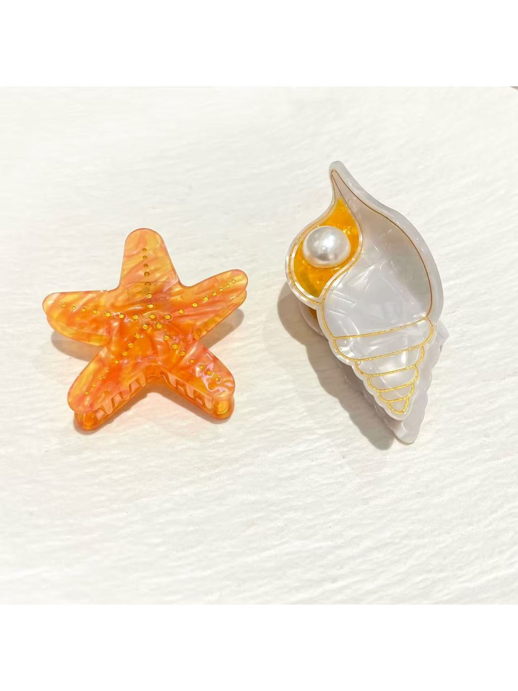 Side view of Beau conch shaped claw clip highlighting curved design and clasp