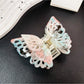 Beau double layer hollow bow shaped claw clip in beige with light shadow