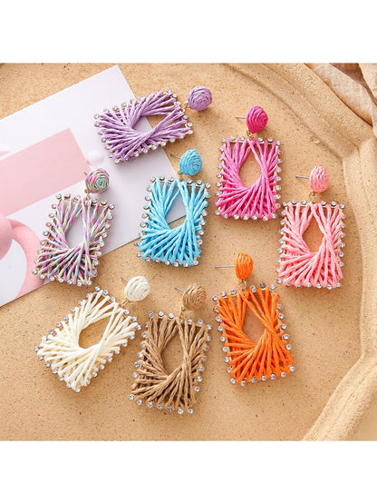Close-up of Earedge raffia square shape drop earrings on white background