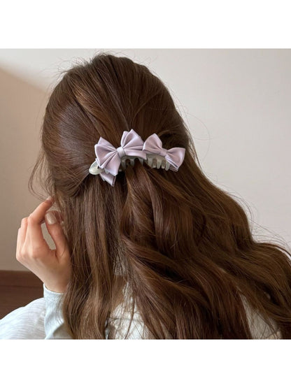 Side view of Beau satin bow banana clip highlighting curved clip design