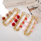 Keypus - Plush Pom Chain Detail Beaded Phone Charm