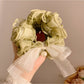 Soft lace bow hair tie styled with casual outfit on a model