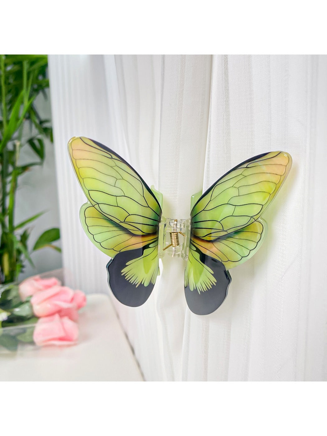 Beau butterfly hair claw clip angled to show thickness and clasp detail