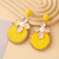 Earedge floral drop earrings with intricate petal patterns in a circular shape
