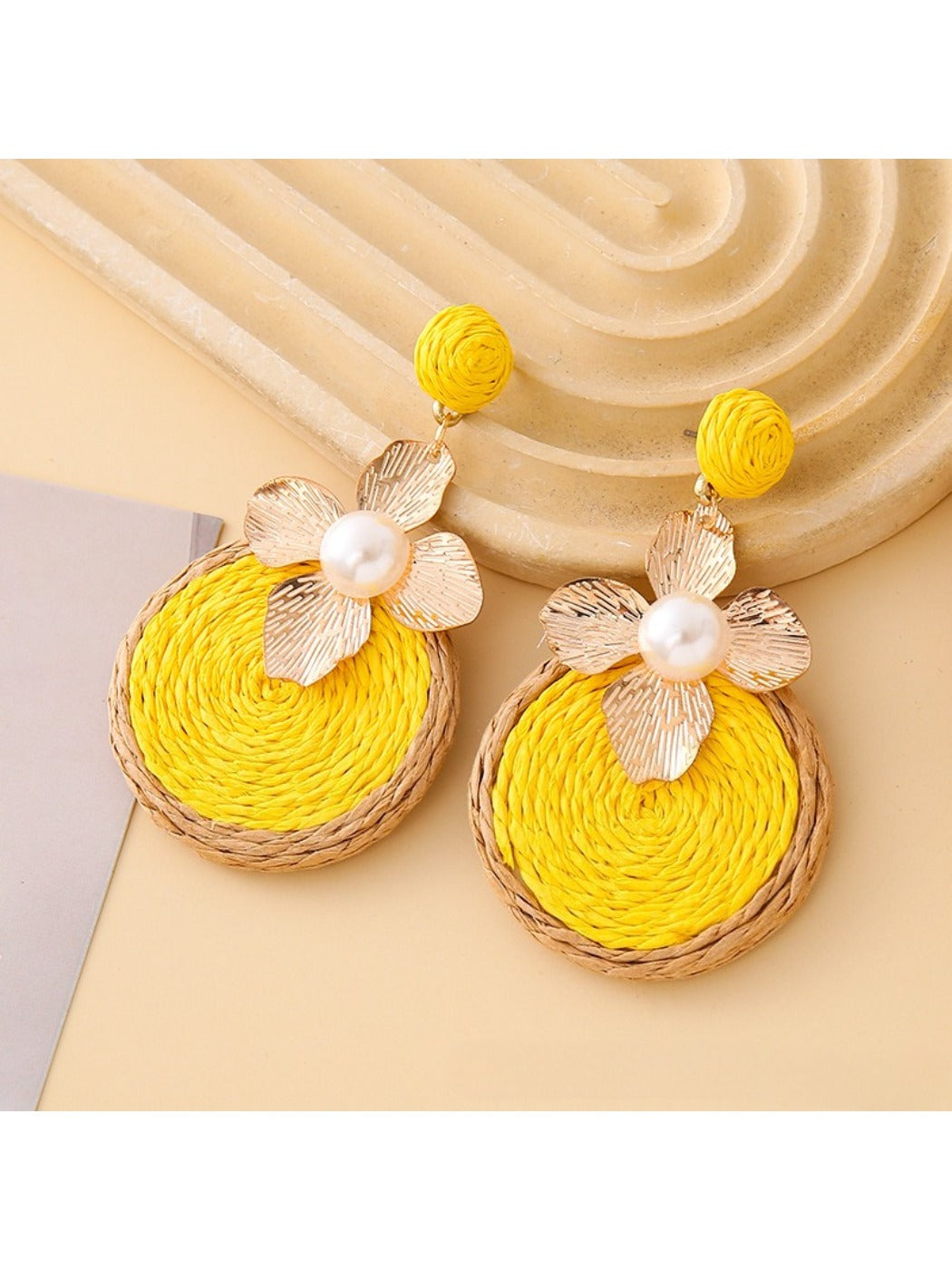 Earedge floral drop earrings with intricate petal patterns in a circular shape