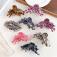 Beau leopard print butterfly shaped claw clip on white background