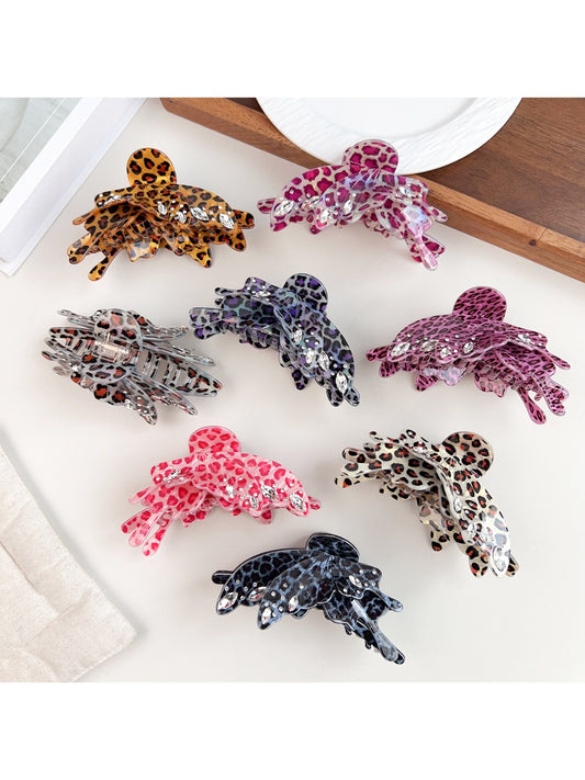 Beau leopard print butterfly shaped claw clip on white background