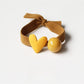 Assorted heart-themed hair ties displayed in a gift box