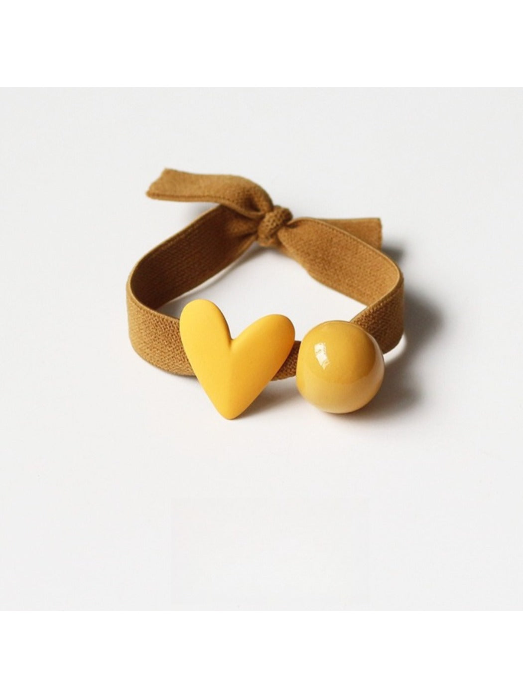 Assorted heart-themed hair ties displayed in a gift box