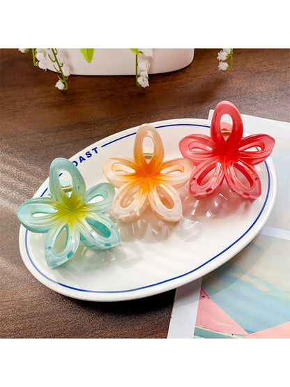 Side view of Beau classic flower hair claw clip highlighting curved shape