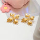 Earedge - Minimalist Petal Cross Stud Earrings