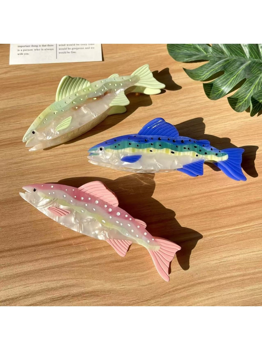 Side view of Beau elegant salmon shaped hair claw clip with curved teeth