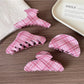 Side view of Beau pink plaid hair claw clip highlighting clasp mechanism
