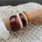 Lovra ombre bangle bracelet worn on wrist showcasing elegant style