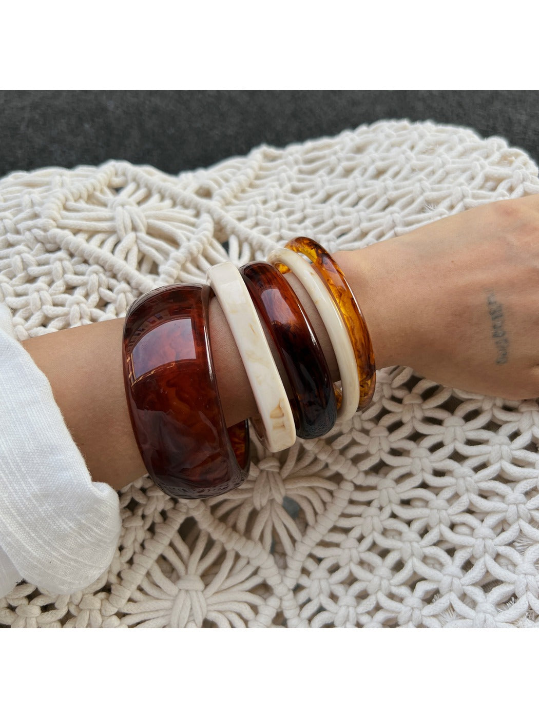 Lovra ombre bangle bracelet worn on wrist showcasing elegant style