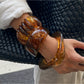 Close-up of Lovra vintage ombre wide band bangle showing gradient color