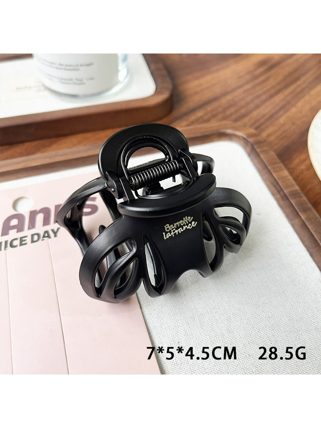 Beau claw clip in matte black, side profile on white background