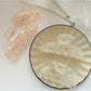 Beau sweet semi circular hair claw clip in beige on white background