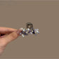 Side view of Beau bright pretty hair clip displaying its curved design and clasp mechanism