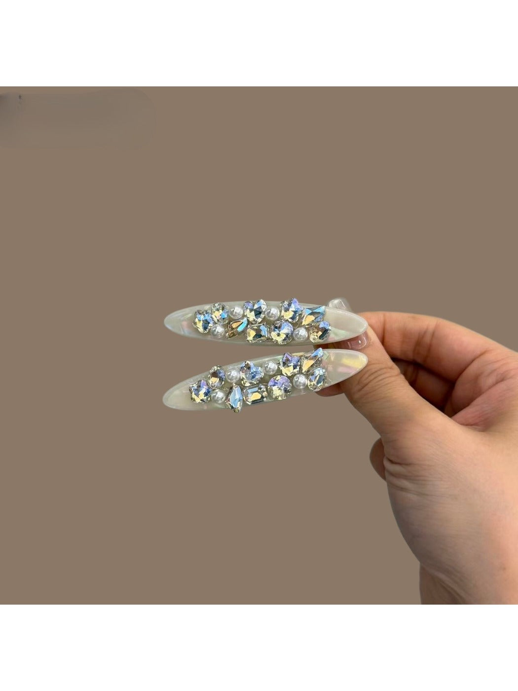 Beau hair clip displayed on a white background highlighting its shine and design