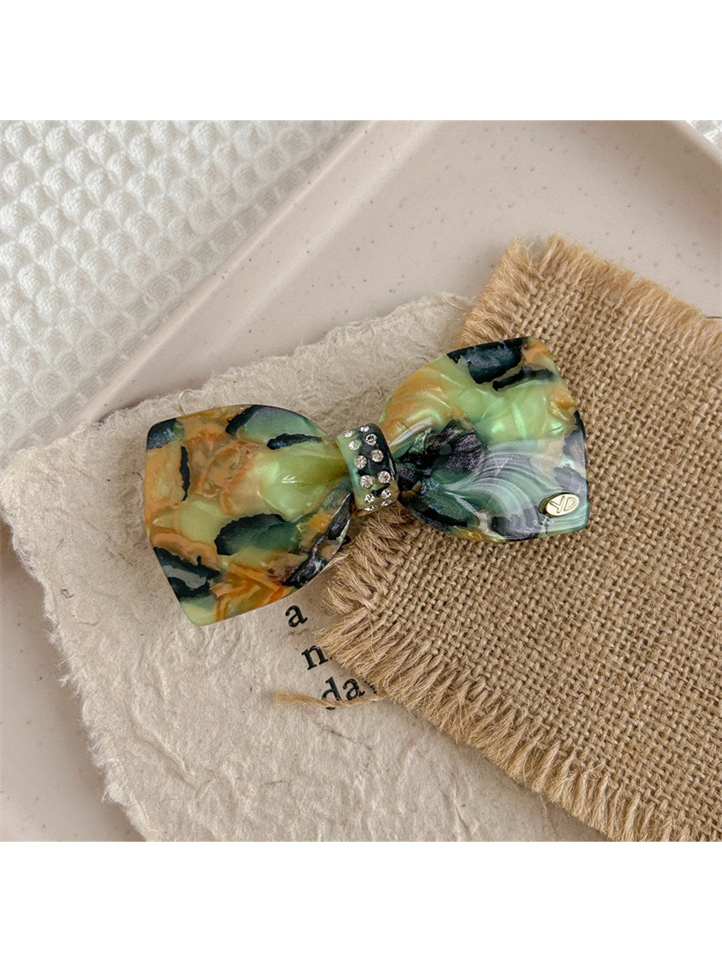 Beau - Marbled Acetate Bow Spring Hair Clip