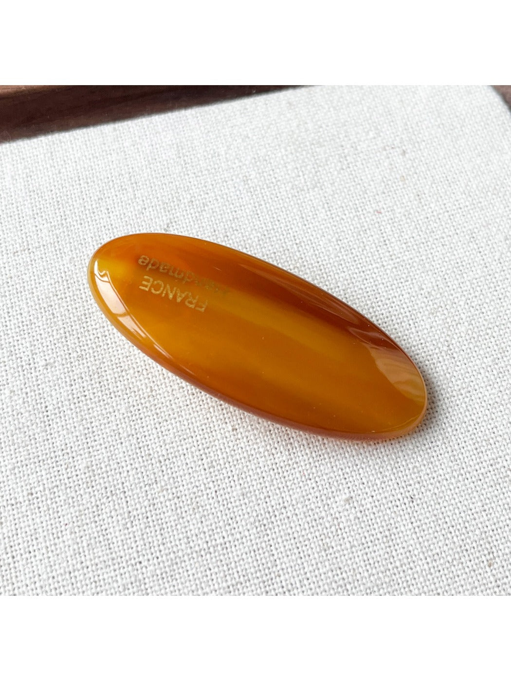 Beau Sweet Oval Acetate Hair Clip clipped in blonde hair